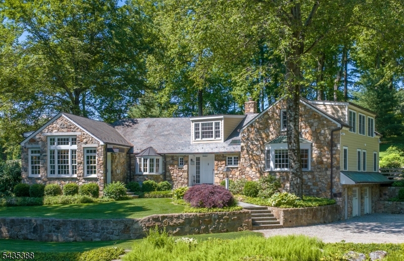 A Rare Offering Set on 8 +- rolling acres atop Bernardsville Mountain (approximately 5 acres deer-fenced) Mature trees, specimen plantings, lush groundcover, and flowering perennials