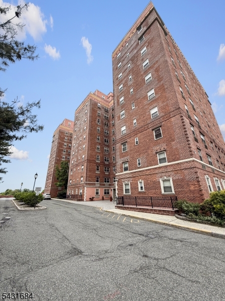 Front Beautifully maintained mid-rise condominium building located in the desirable Empire View community at 70 South Munn Avenue.