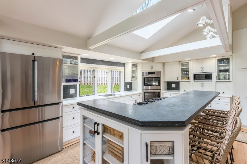 Beautiful Kitchen with white cabinetry that is open to your entertaining space.  Open to Living Room as well as Dining Area.