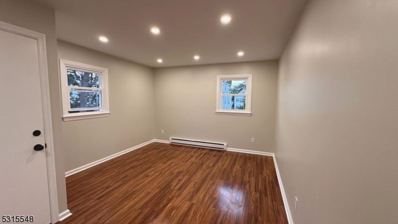 Large living room with recessed lighting.