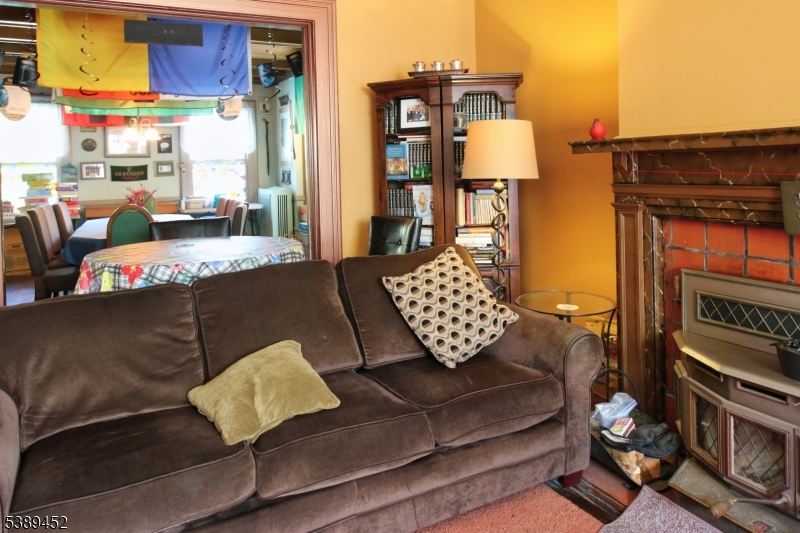 Living room view 2 Rooms are large with wood trim & pocket doors.