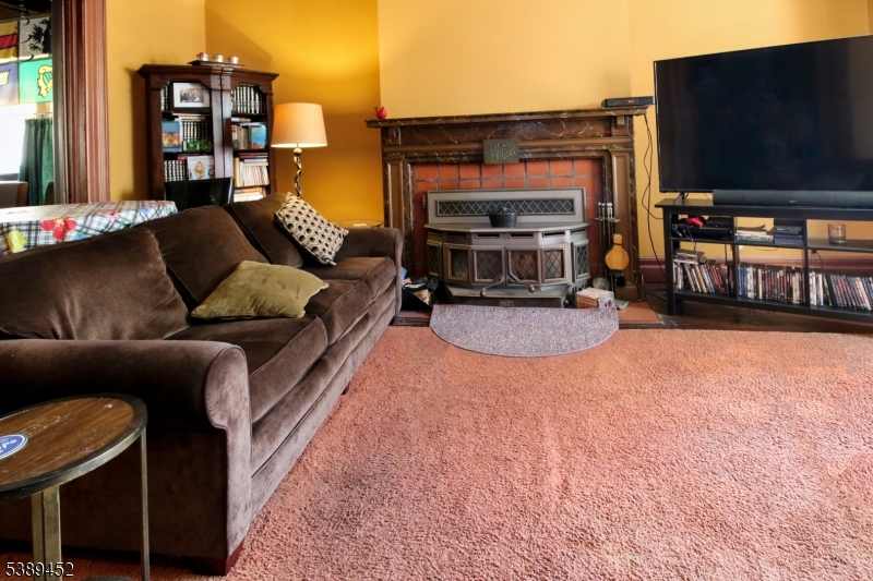Living room with fireplace High ceilings provide a perfect place for entertaining.