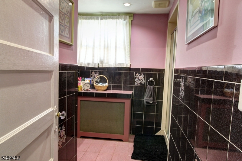 1st fl Full Bath view 1 Full bathroom located on first floor is convenient for guests.