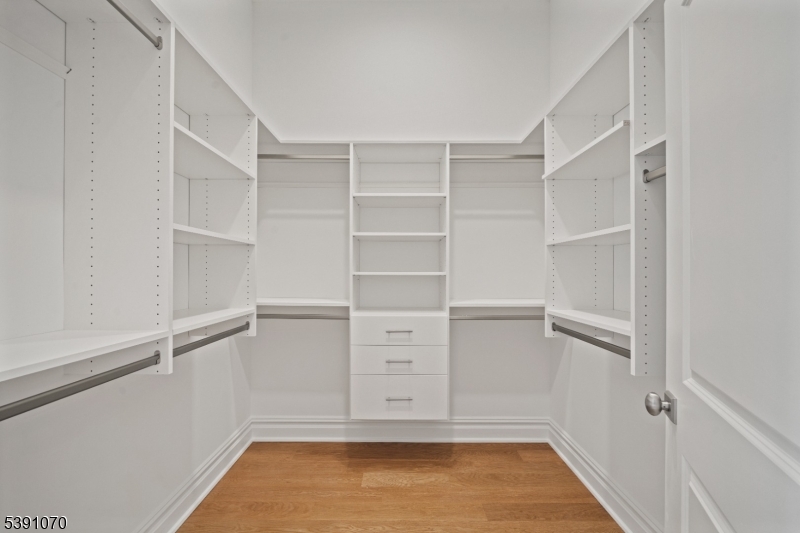 Primary Walk-In Closet One of two walk-in closets!