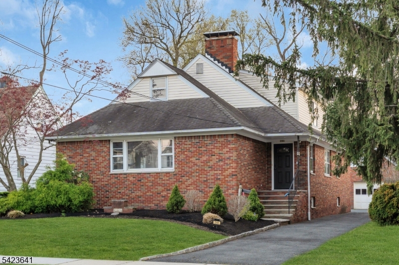 Classic full brick exterior offering timeless curb appeal and low maintenance. Welcoming entry with a brand new front door and updated steps leading into the home. Landscaping is currently in progress, giving the next owner the opportunity to enjoy.