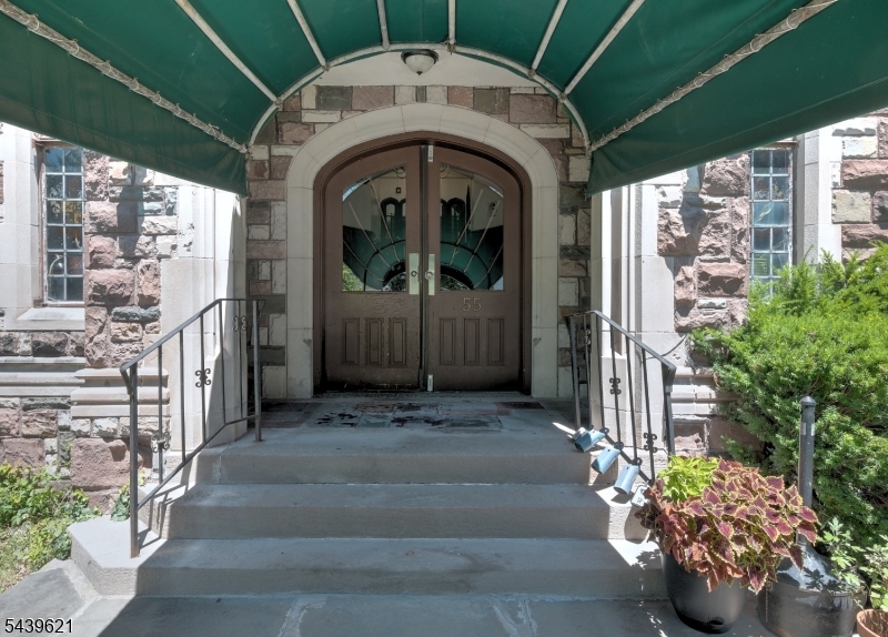 Main Entry Canopied walkway to arched doorway
