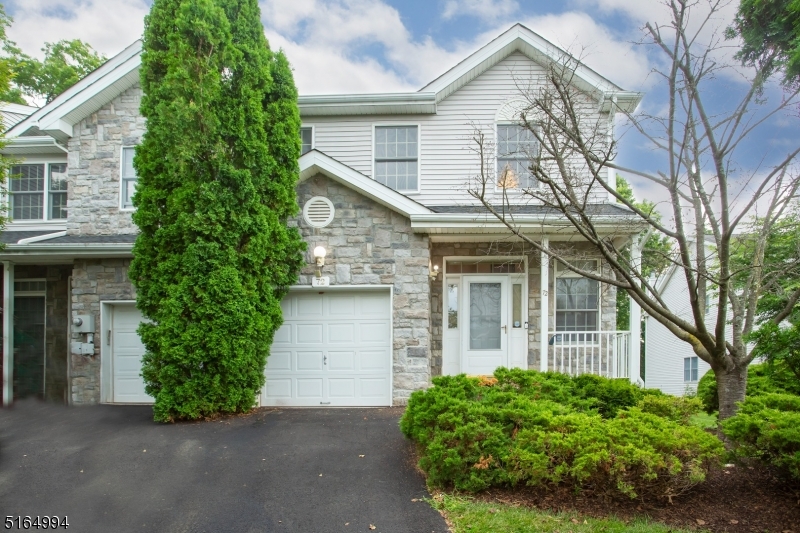 Welcome home to this beautiful end unit in one of Parsippany's most desirable townhouse communities, Mazdabrook.
