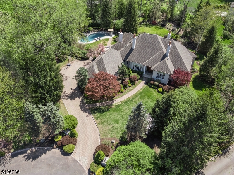 Breathtaking Curb Appeal Tucked away on a private, tree-lined lot in one of Watchung?s most prestigious neighborhoods