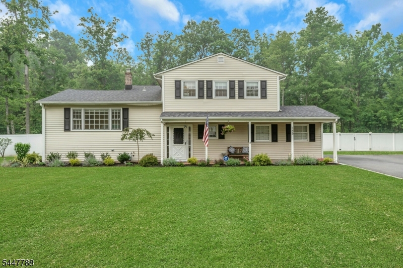 Front Exterior Beautiful curb appeal with a newer roof, gutters, fresh landscaping, and an attached one-car garage.