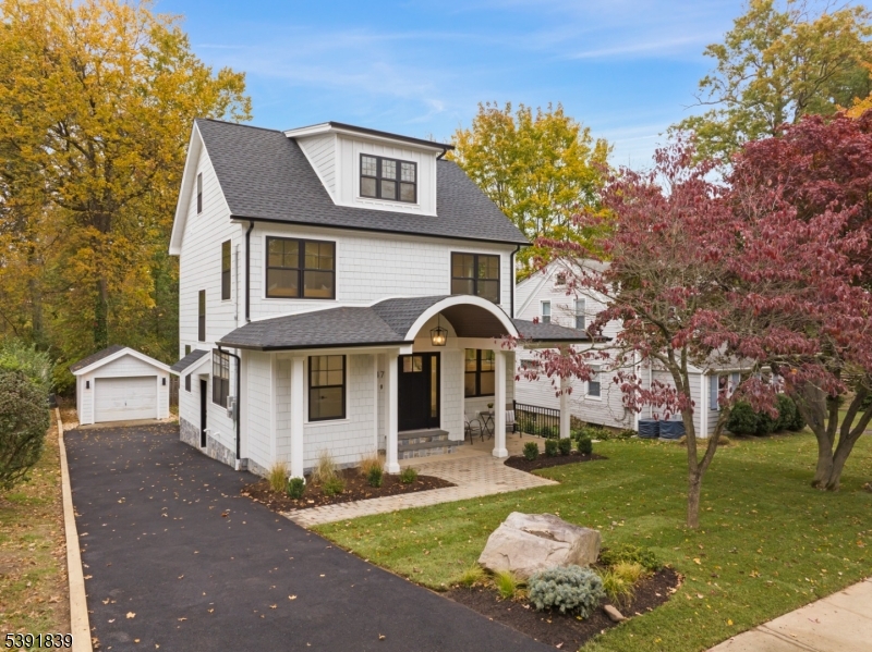 Front Totally redone Custom Colonial w/1 car garage. The garage door is being replaced.