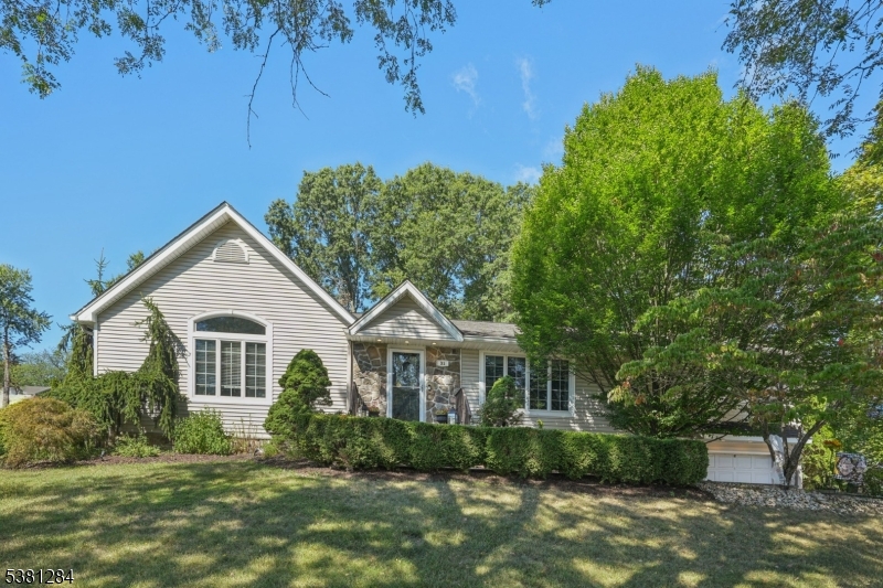 Welcome home to this beautifully maintained 3 bedroom 2.5 bathroom Expanded Ranch nestled on a quiet wooded lot in the heart of Wayne.