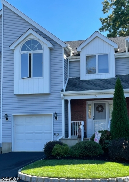 Private front and back entrances, built in one car garage. Driveway parking and one reserved space in lot