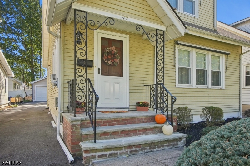 covered portico blue stone walk way and steps