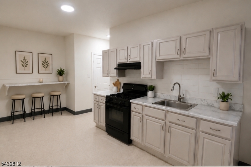 Kitchen Virtually staged with Breakfast Bar, there is room for a breakfast bar.