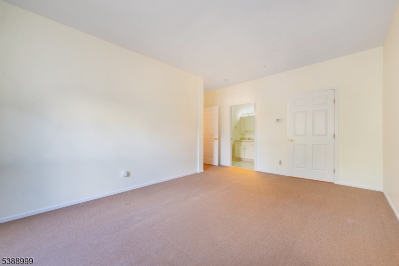 Primary Bedroom Shows door to the Ensuite Bathroom