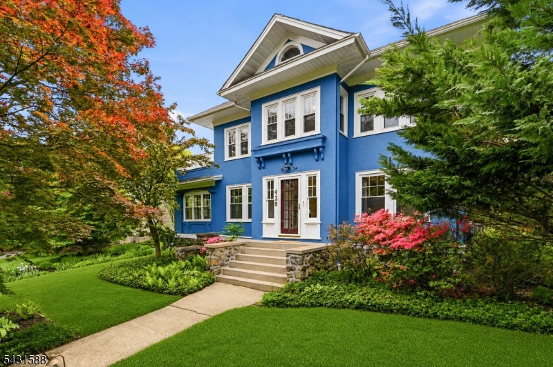 Front of Home Surrounded by mature landscaping
