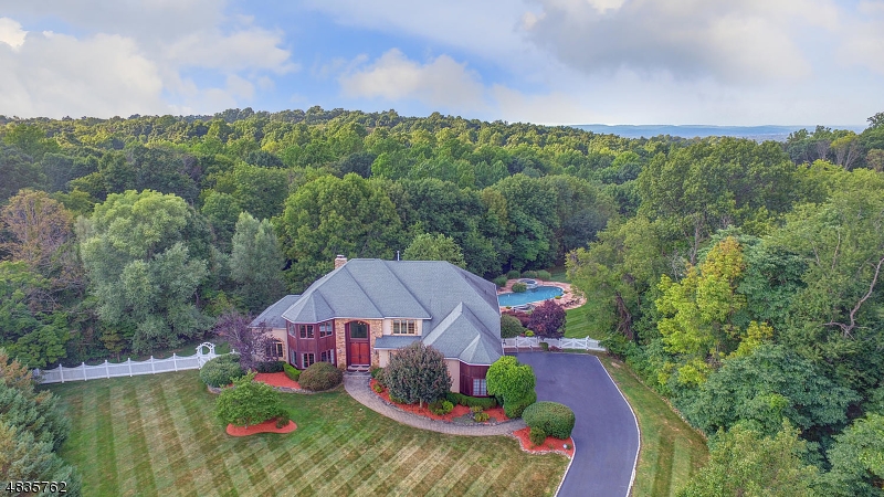 This spectacular colonial features 5 bedrooms, 6 full baths set on a private cul-de-sac with a backyard oasis