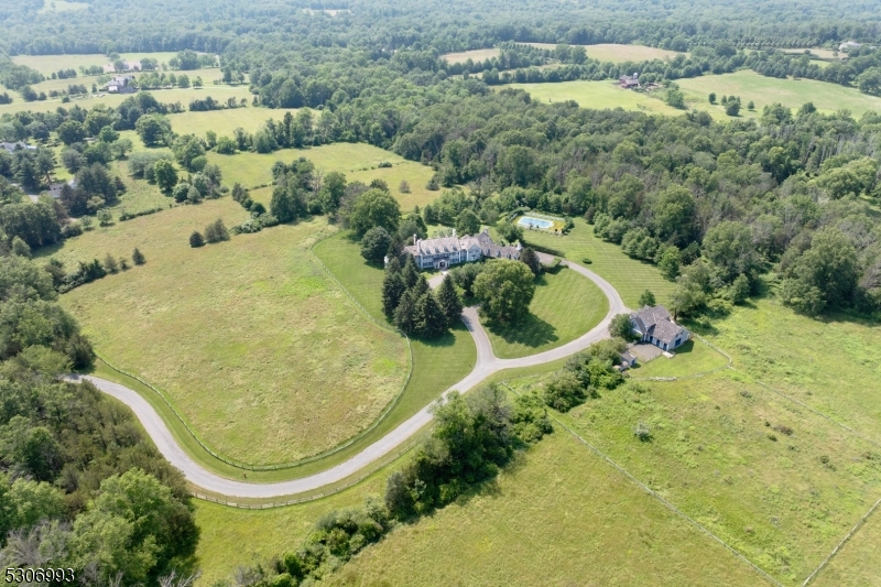 Set on 44Â± open, rolling acres in Bedminster Hunt Country, an exceptional gated Colonial Revival estate with equestrian facilities is set along one of the township's most desirable lanes.