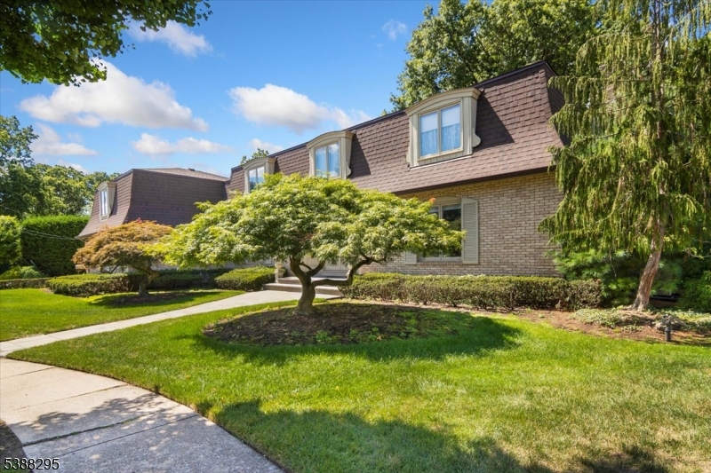 Front Beautiful landscaped front lawn with lush grass
