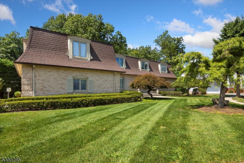 Front tastefully designed landscaping that enhances the homes curb appeal