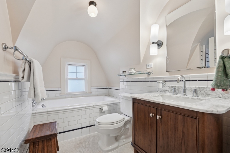 Full Bath Full shower tastefully tucked behind the door