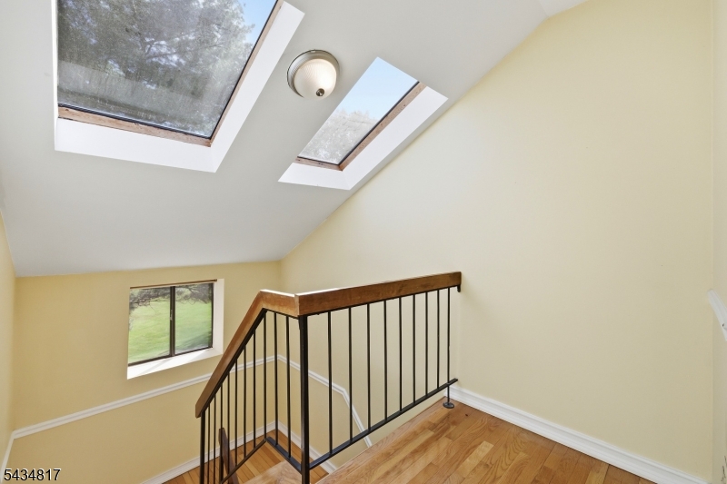 Upstairs landing w/ skylights.
