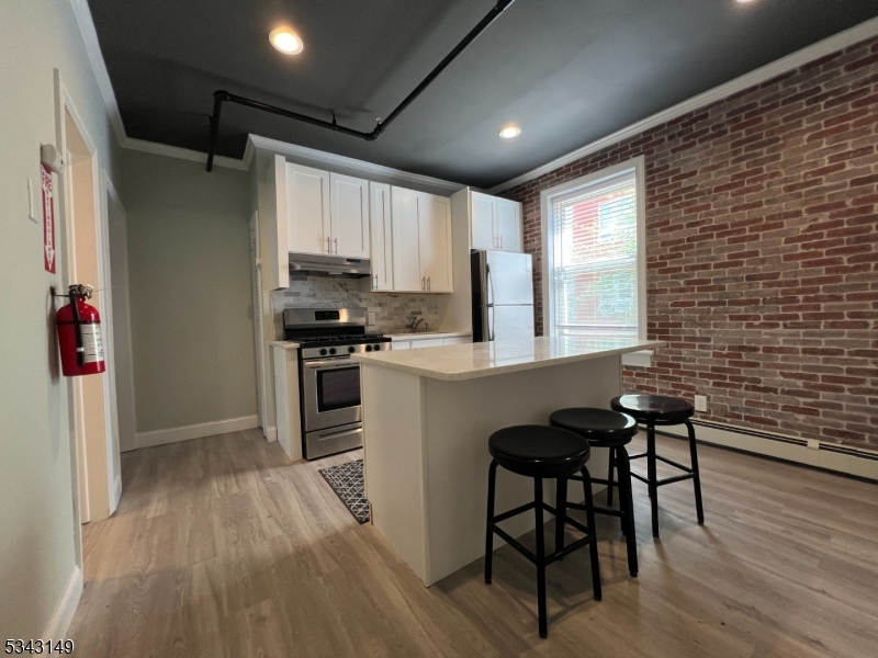 VIEW OF KITCHEN FROM ENTRANCE
