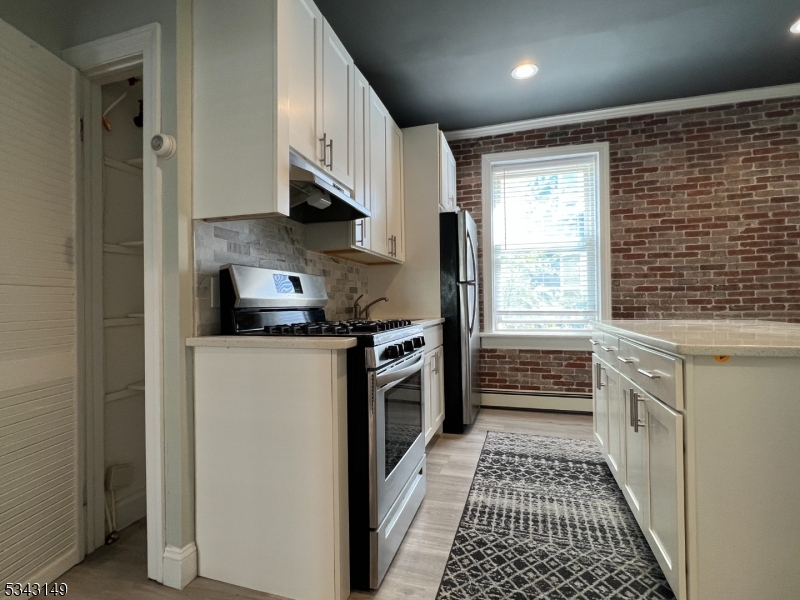 VIEW OF KITCHEN FROM MAIN ROOM