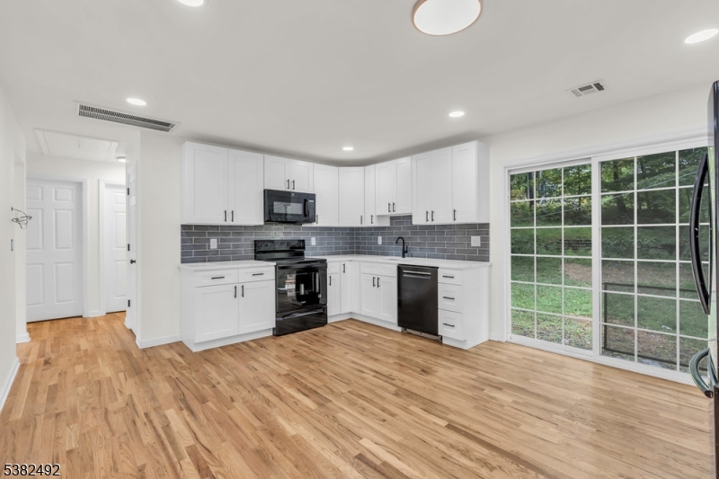 Kitchen w/ sliders to backyard