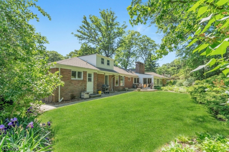 back of house with grass